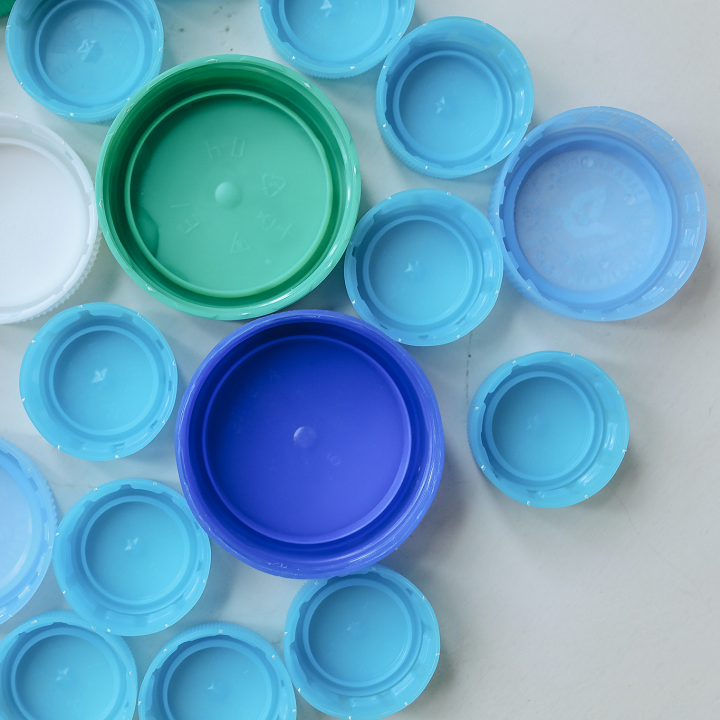 green and blue plastic bottle caps